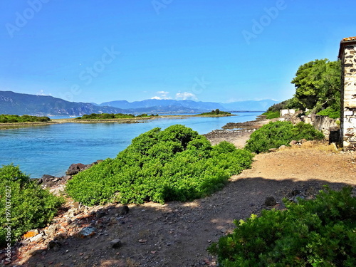Greece - view on the coast of Monolia island near  the town of Kamena Vourla on the mainland