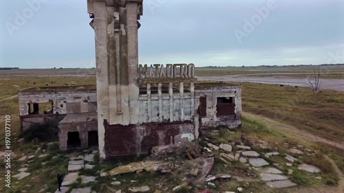 Close up of the concrete letters of the slaughterhouse indicating the site of the 1985 flood disaster in Villa Epecuen. Gloomy atmosphere.