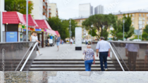Canvas Print Marble surface overlooking blurred city street with people cycling in Moscow