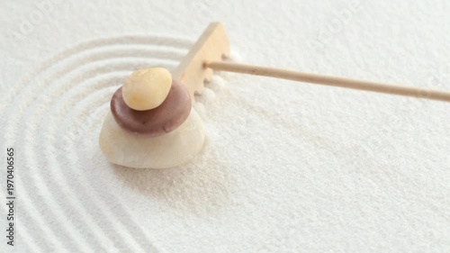 Making zen garden with stones and white sand