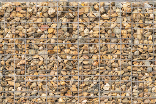 Modern Gabion Wall From Rocks And Stones In Metal Wire Box. Reinforcement and Abutment Protective Construction