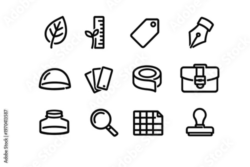 Set of minimalist black line icons for creative design and supplies including pen nib briefcase and magnifying glass on white background