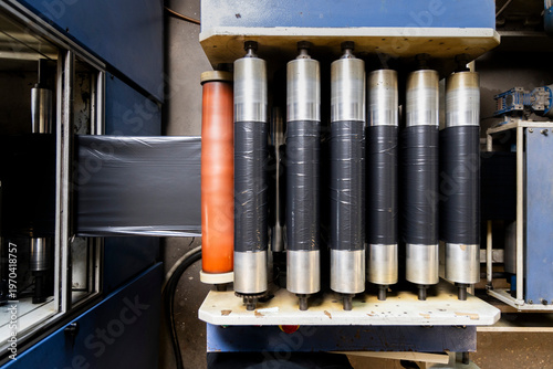 Plastic film rolling on industrial machine production line