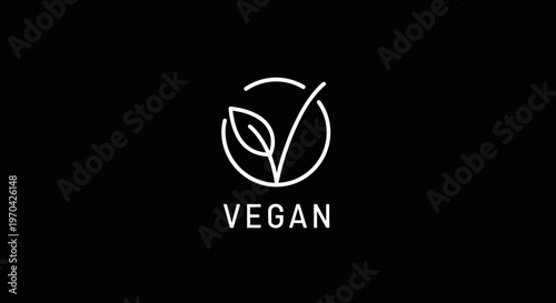 Vegan symbol with leaf and checkmark on black background.
