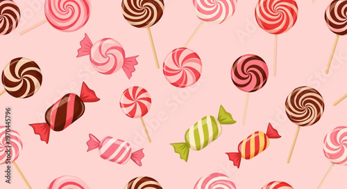 Assortment of colorful lollipops and candies on pink background.