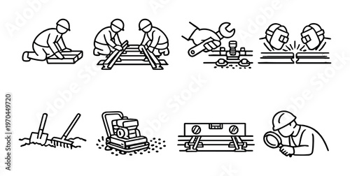 Railway workers performing track maintenance and inspection tasks