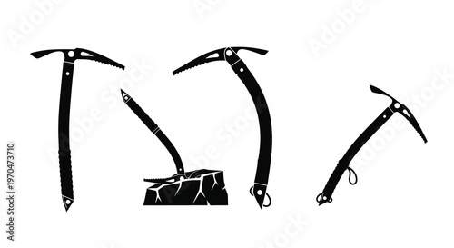 Black ice axes and crampon depicted in a striking silhouette