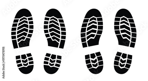 Four boot sole prints presented in a stark black silhouette