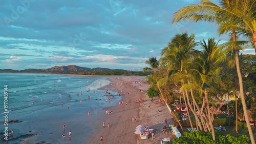 Tamarind Costa Rica aerial view of Playa Tamarindo in the afternoon with palm trees and tourists on the beach