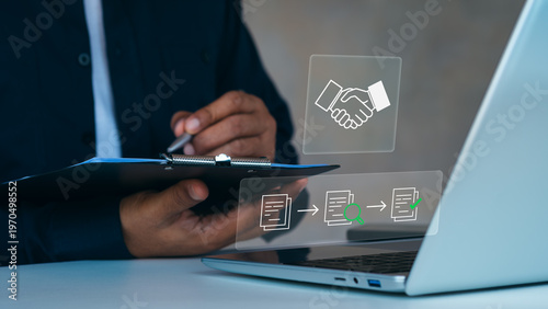 Procurement process management, Digital and paper document approval, contract verification, supplier negotiation, and business purchasing operations using laptop and paper in office environment