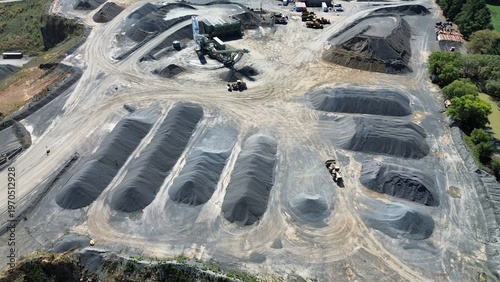 Fotografi Aerial drone view of quarry stockpiles with organized gravel and aggregate mater