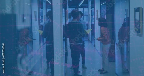 Canvas Print Discussing colleagues standing in narrow glass office corridor, holding yellow f