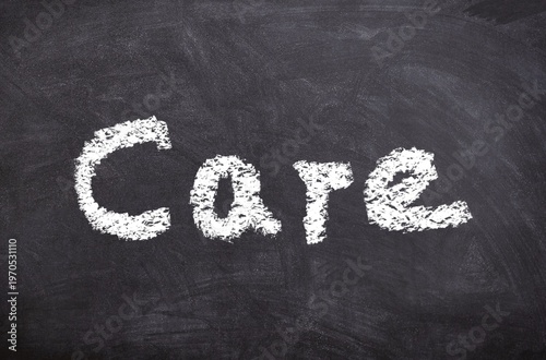 Hand drawn chalk sketch on blackboard with the text Care symbolizing compassion empathy and support
