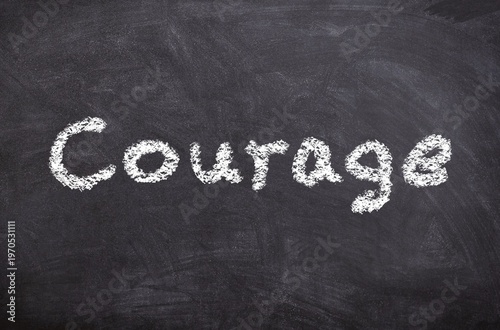 Hand drawn chalk sketch on blackboard with the text Courage symbolizing bravery determination and resilience