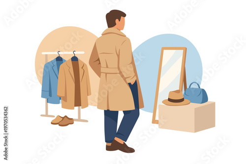 Stylish man in a trench coat looking at a mirror in a boutique