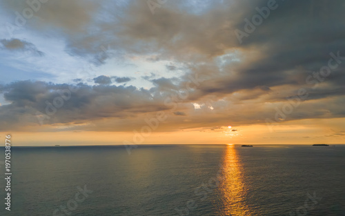 Stunning sunset paints the sky and ocean with vibrant colors above the tranquil horizon