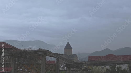 Orthodox church in misty mountains of Georgia