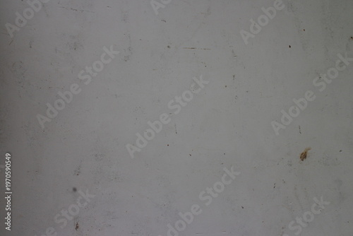 Clean light grey concrete plaster wall texture with subtle spots