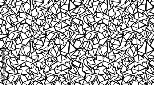 Black and white abstract tessellated pattern of irregular shards and fragments.