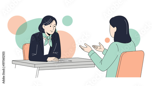 Job Interview: Two Women Discussing Business at a Desk