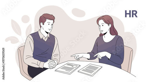 HR professional interviewing a candidate, discussing documents at a table