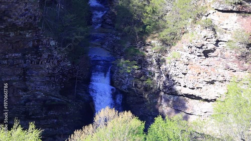 Wallpaper Mural Waterfall cascading down rocky cliffside with trees. Torontodigital.ca