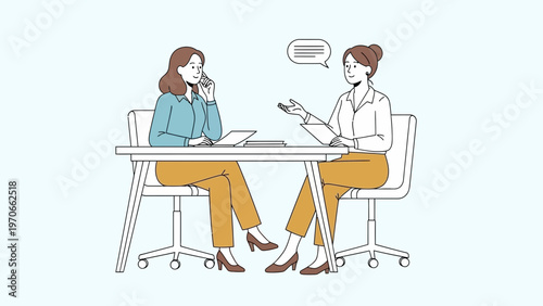 Two women in business meeting, one on phone, discussing ideas at office desk
