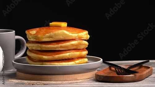 Fluffy Japanese souffle pancakes stack with butter and maple syrup