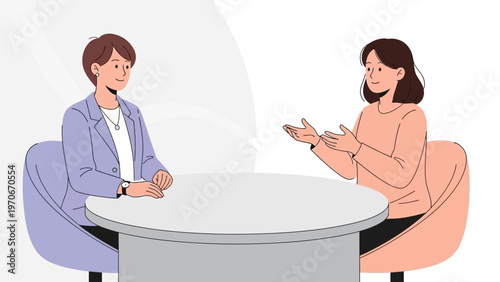 Two women in a business meeting, discussing ideas at a round table, professional conversation