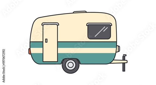 Vintage camper trailer on wheels outside.