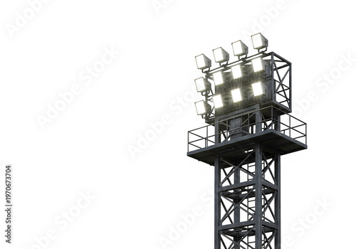 A tall industrial stadium light tower featuring a massive array of illuminated bright floodlights