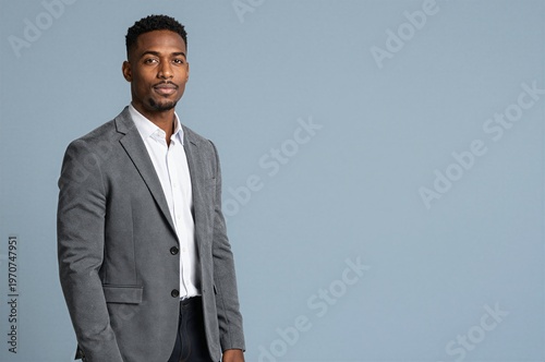 Young businessman studio portrait isolated on pastel background