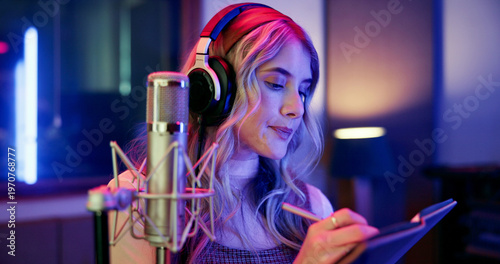 фотографія Woman, musician and writing notes in studio for songwriting, editing lyrics and recording audio