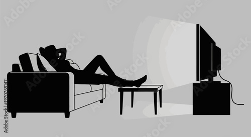 Woman relaxing on couch watching tv in modern living room with gray background