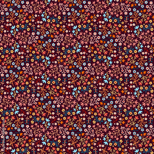 Ditsy print Small flat colorful flowers isolated on a dark chocolate brown background Vibrant summer floral pattern Simple botanical design