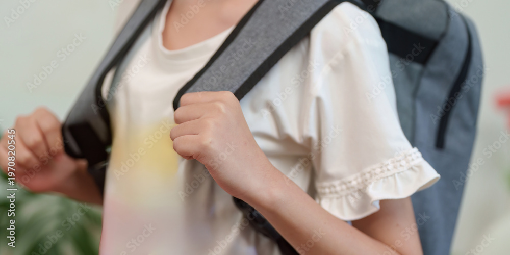 Naklejka premium Child wearing a backpack ready for school
