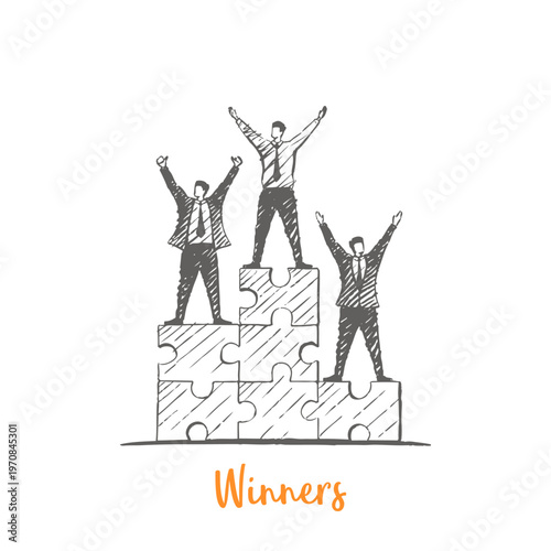Winners - successful business team standing on puzzle blocks