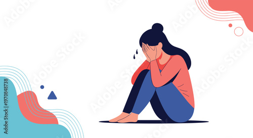 Depressed woman sitting on the floor with her head in her hands while crying and feeling lonely and very stressed out.