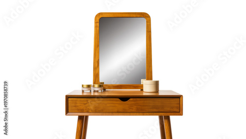 Fotografie Wooden vanity table with rectangular mirror, displaying three small cosmetic jar