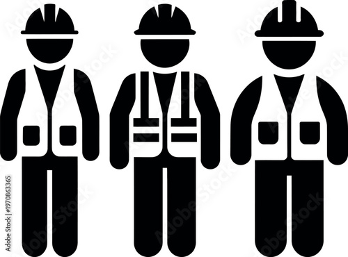 Three construction workers wearing safety gear and high-visibility vests