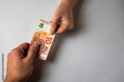 Foto Giving money by hand concept financial help