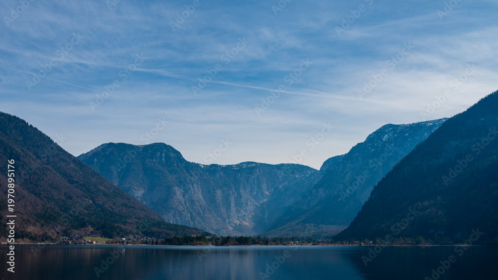 Obraz premium Alpine lake, river with mountain reflections and dramatic mountains in Austria