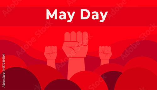 A raised fist symbolizes unity among people celebrating May Day outdoors