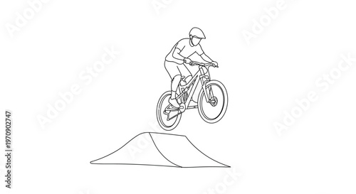 Man riding mountain bike on jump.