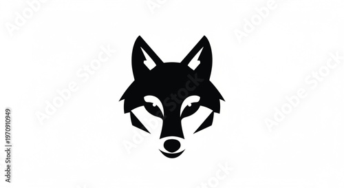 A bold and minimalist black vector logo of a wolf's head, presented in a symmetrical, stylized design against a clean white background. This powerful graphic represents strength, intelligence.