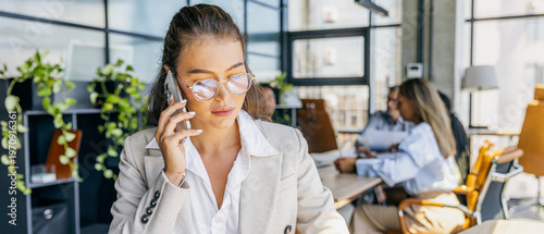 Focused account manager negotiating with team in professional manner