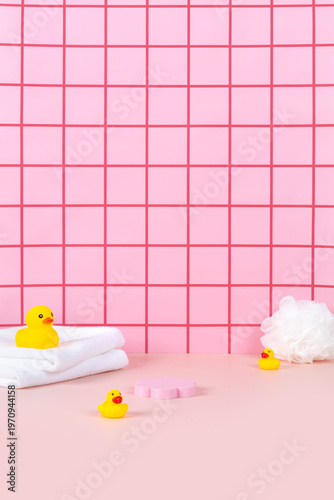 Sweet pink bathtub and yellow rubber duck in pink bathroom background