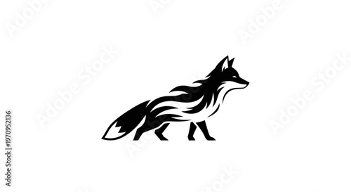 Black silhouette of a fox walking.