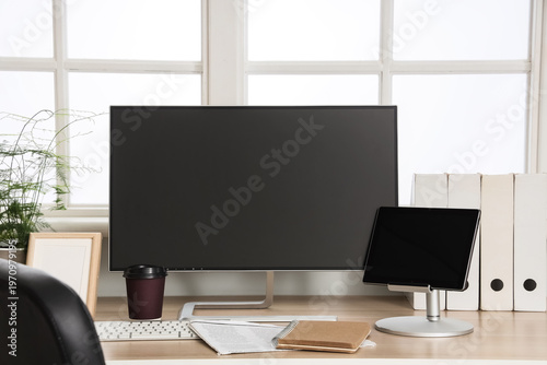 Workplace with blank comput...