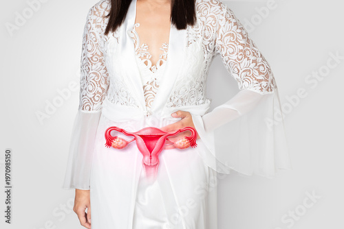 Female in white lace nightwear holding abdomen with highlighted uterus, symbolizing gynecological disorders, pain, hormonal imbalance, and reproductive health issues